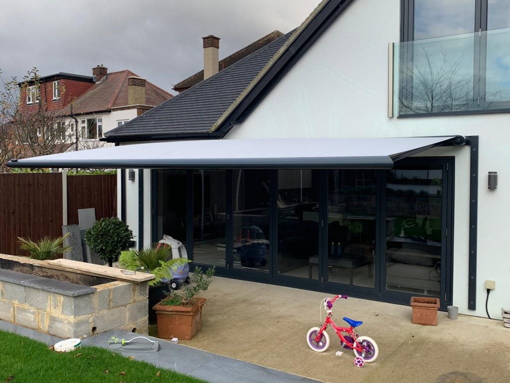 White end-fixed patio awning