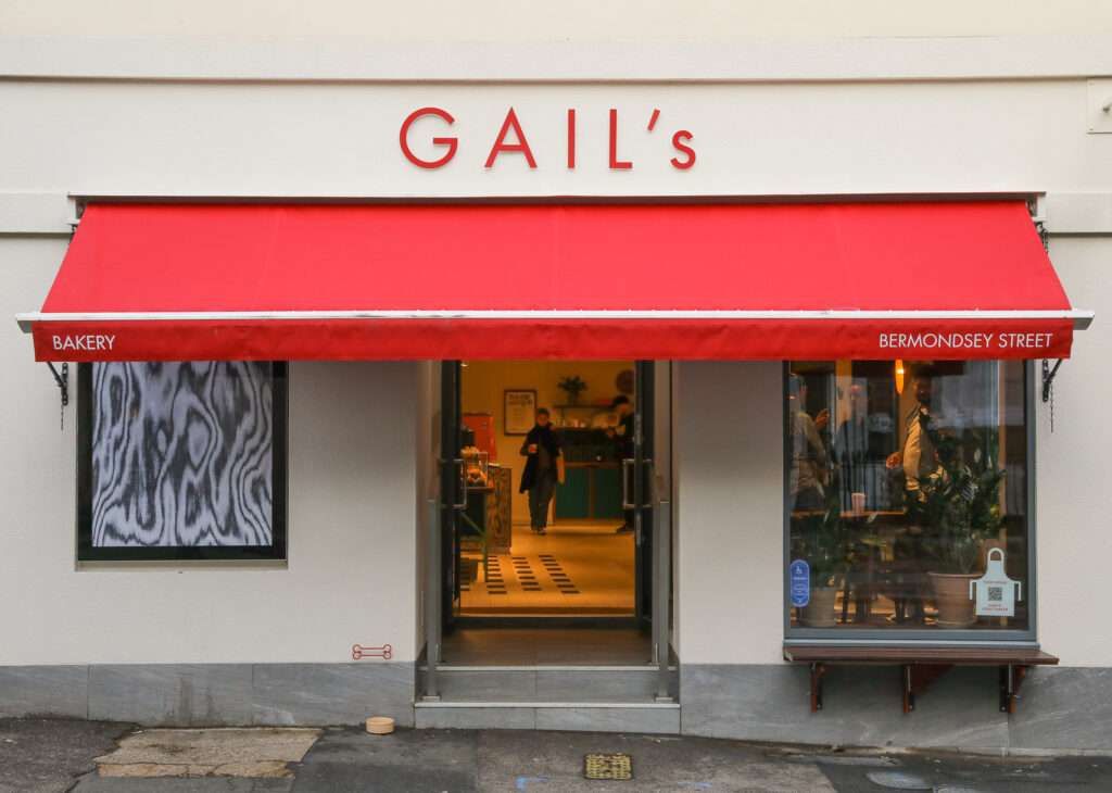 Red awning of Gail’s Bakery
